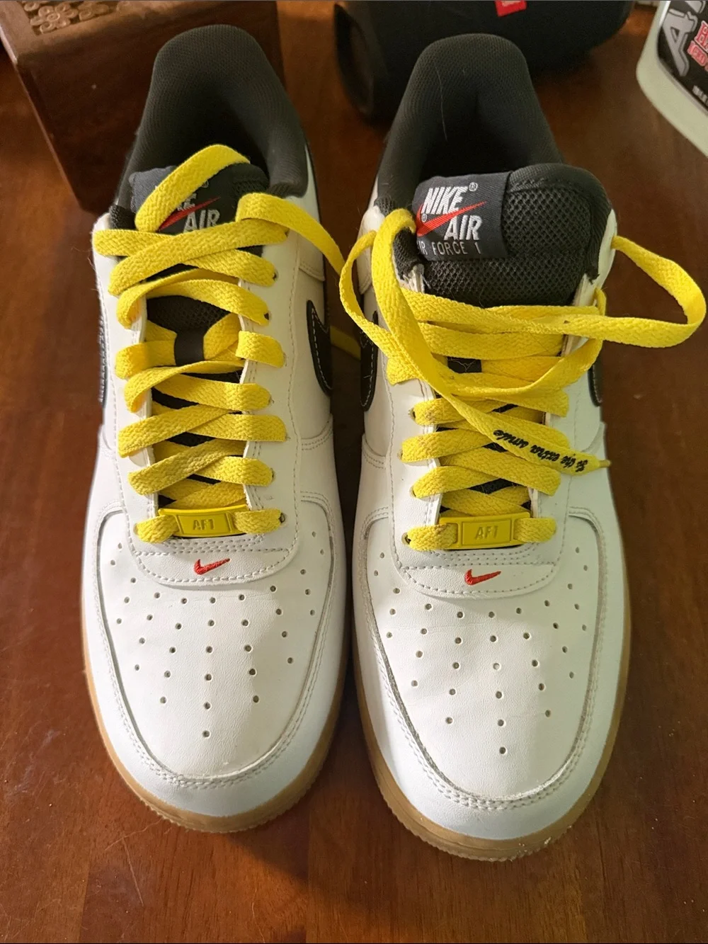 Nike Men’s White AF1 Sneakers with Black Swoosh and Yellow Laces